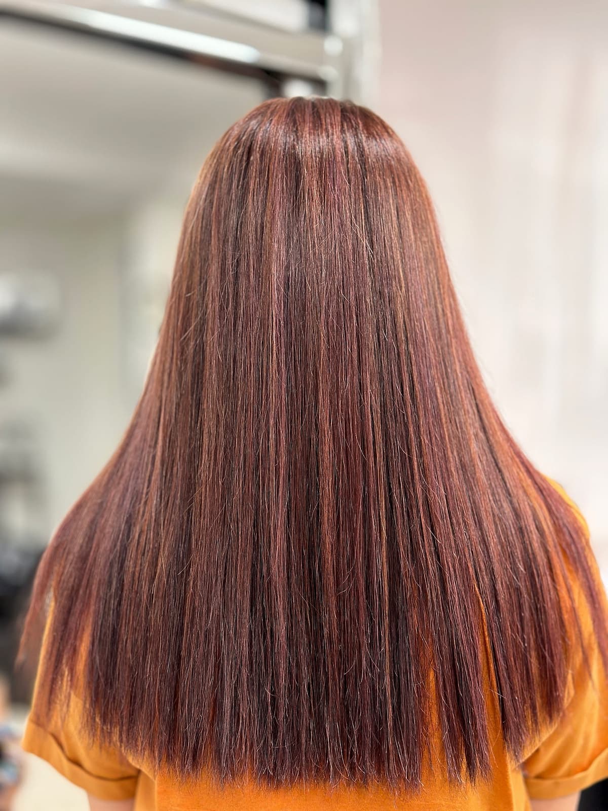 Rich burgundy hair colour by The Lounge Marbella