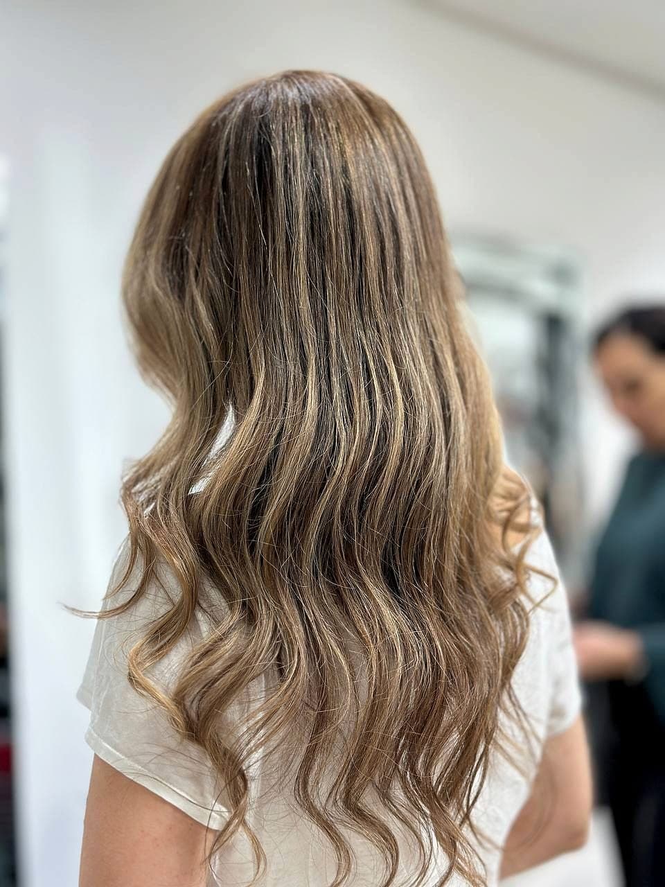 Soft balayage on curled hair by Afsaneh Farahmand