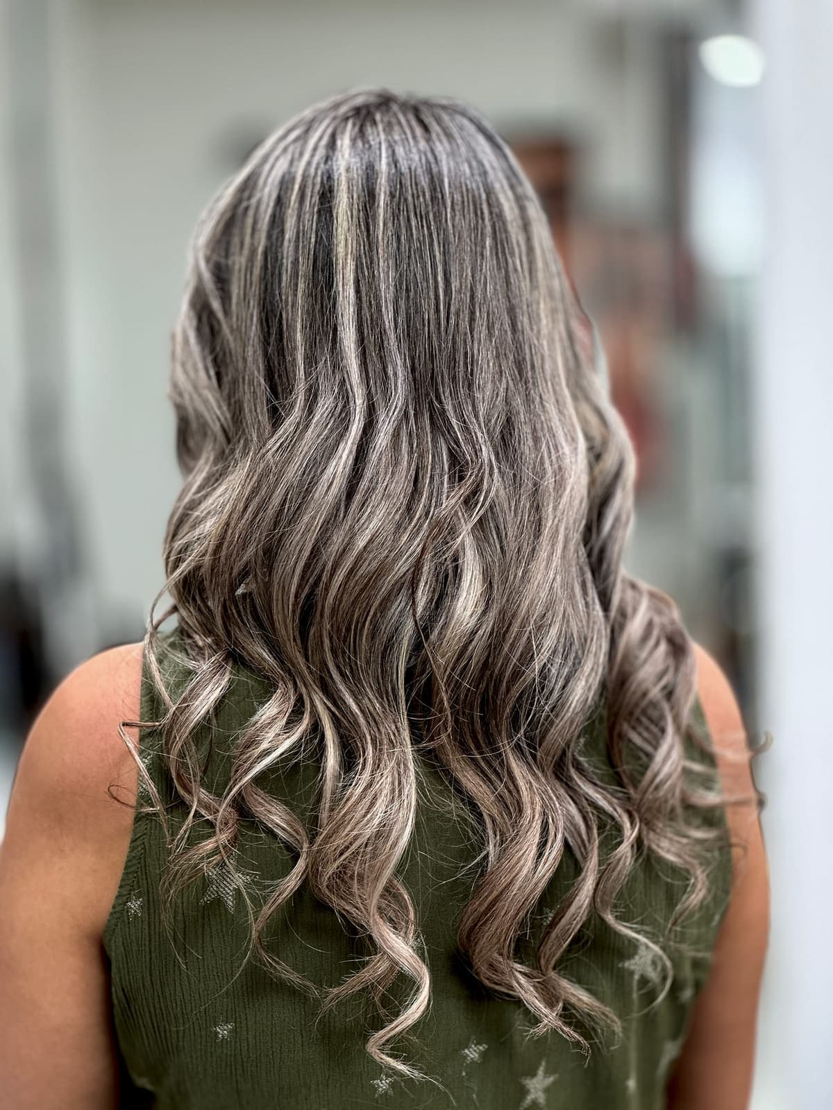 Soft silver balayage waves Marbella hair salon