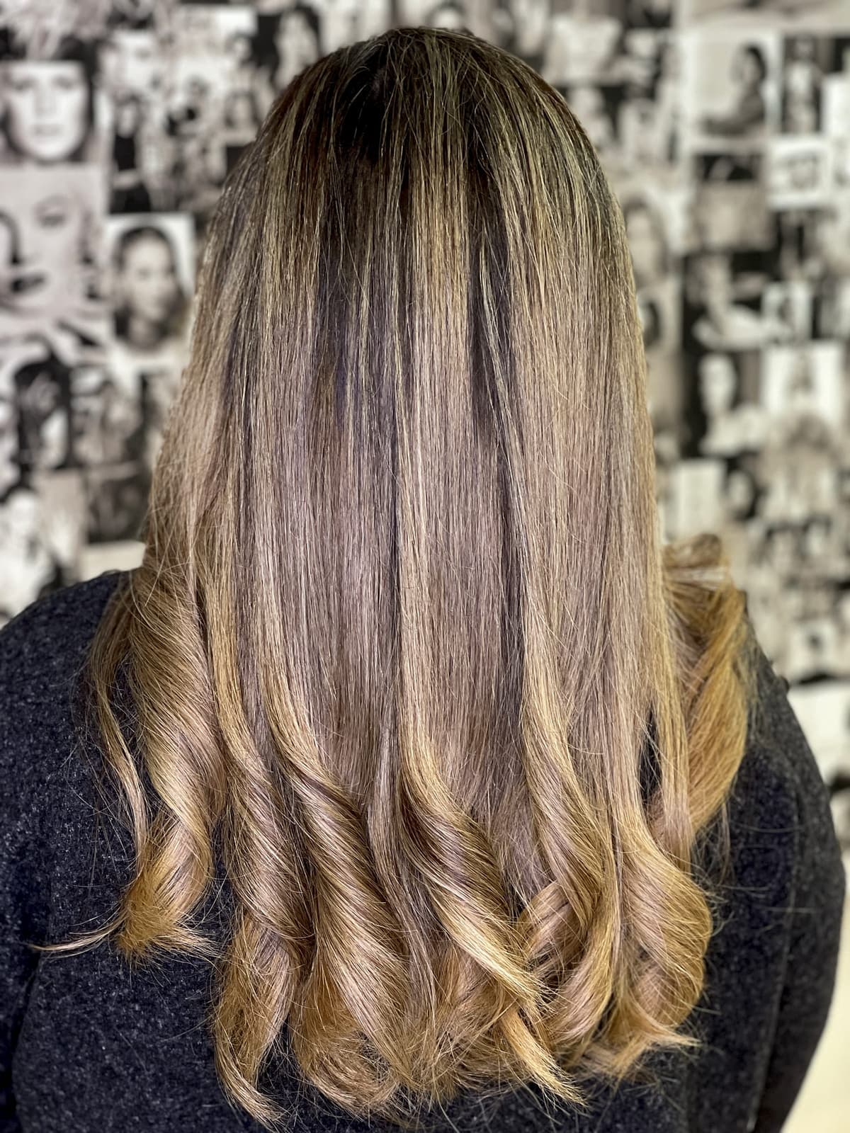 Golden balayage with soft curls, hand-painted at The Lounge Marbella