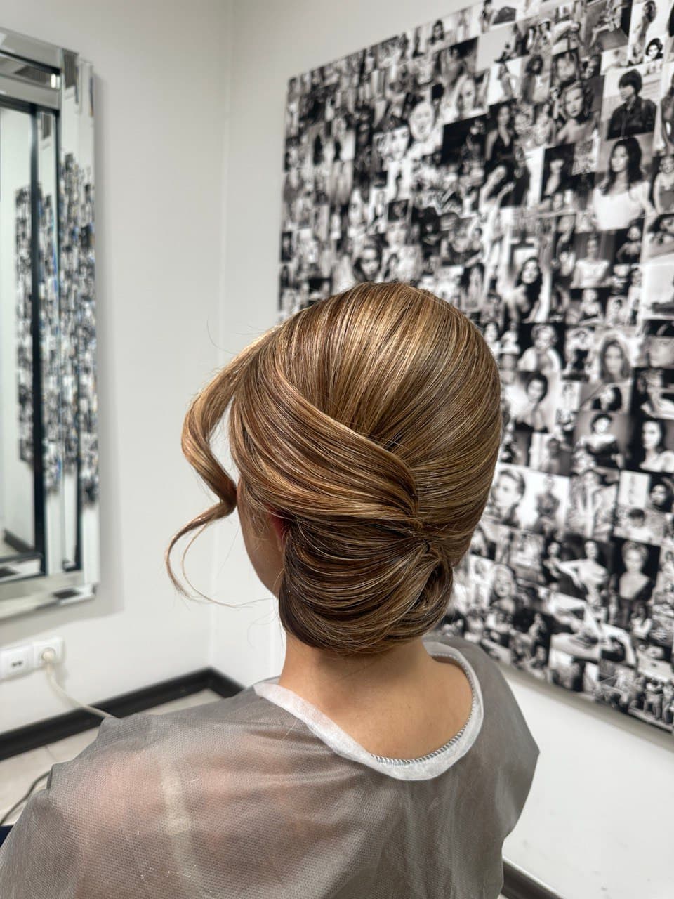 Elegant low chignon updo styled at The Lounge Marbella for an event near Puerto Banus